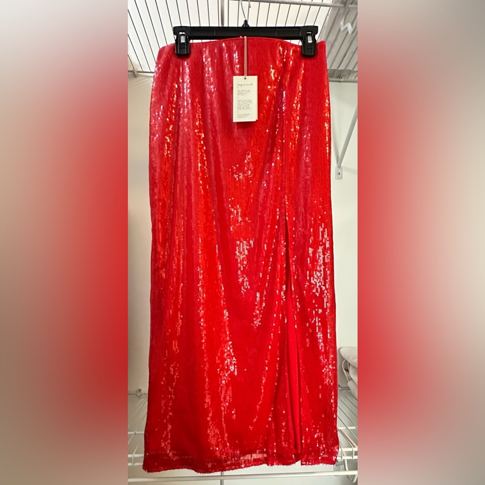 Brand: A New Day, red shimmer, size small long shirt with high left slit.